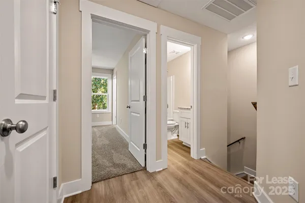 a bathroom with a granite countertop sink toilet a shower and a mirror
