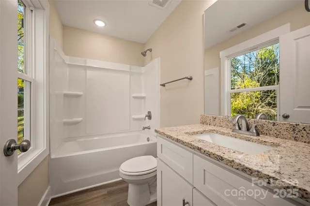 a view of room with window and closet