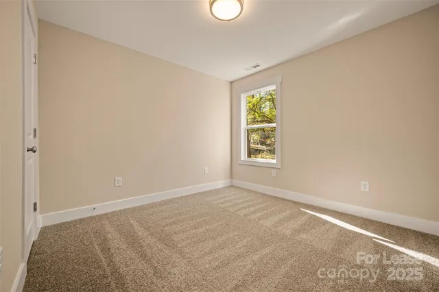an empty room with closet area