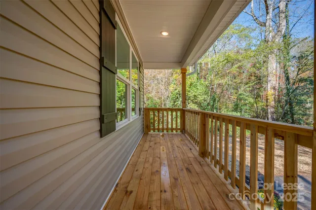a view of balcony with wooden floor