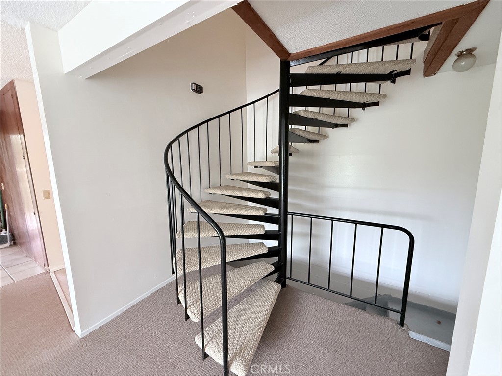 2575 Riverside Terrace Los Angeles, CA 90039 - Photo 12 of 29 a view of staircase with lots of white walls and a window
