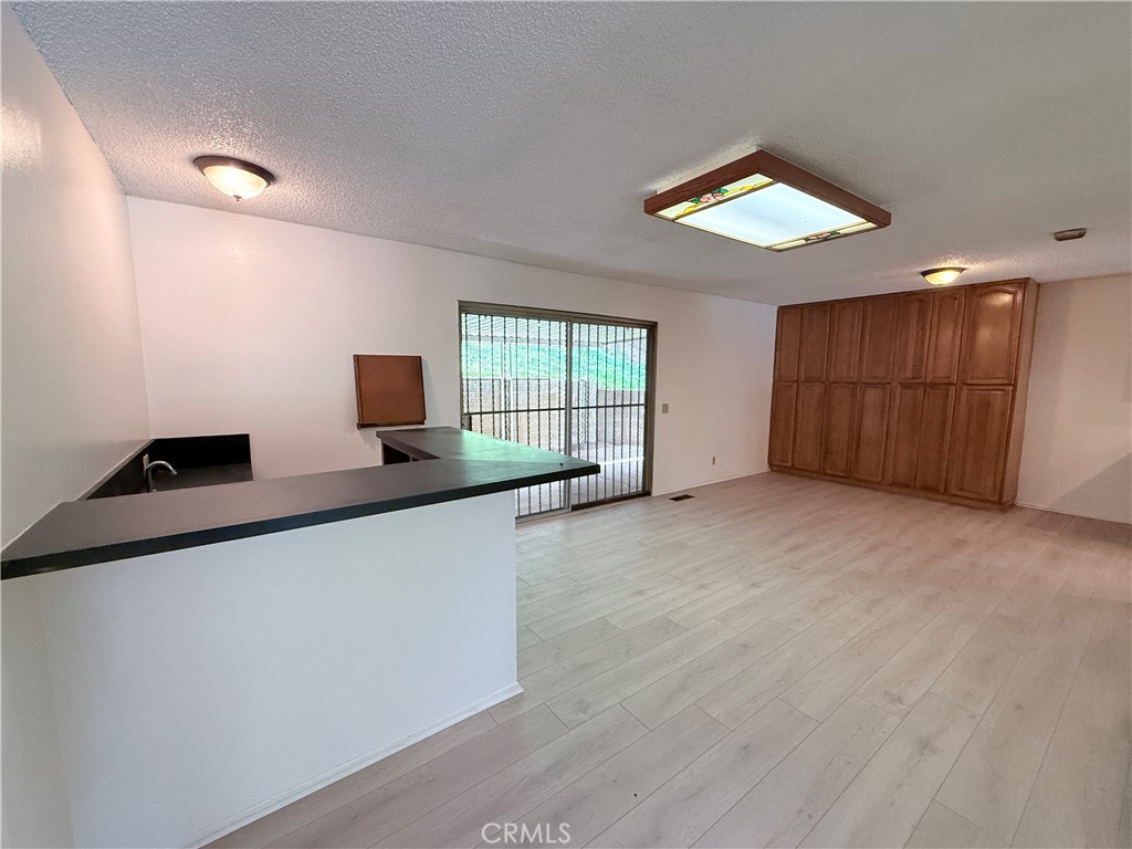 2575 Riverside Terrace Los Angeles, CA 90039 - Photo 9 of 29 an empty room with windows and ceiling fan
