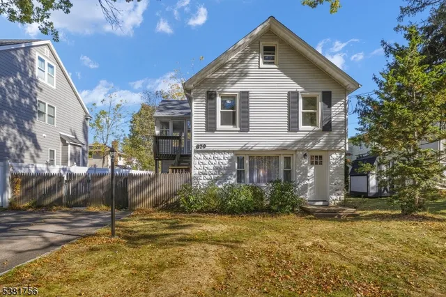 a kitchen with stainless steel appliances a refrigerator sink and cabinets