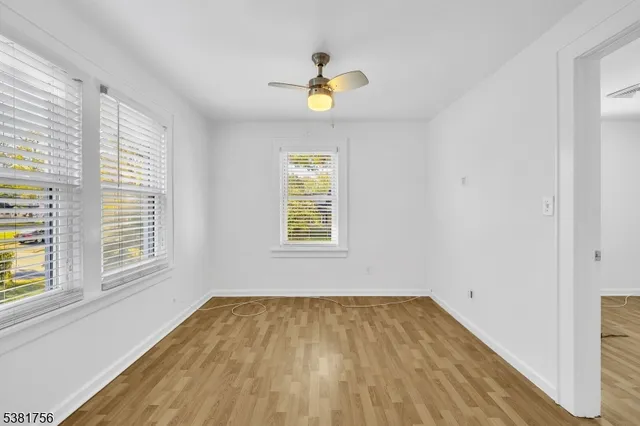 a view of backyard of house with green space