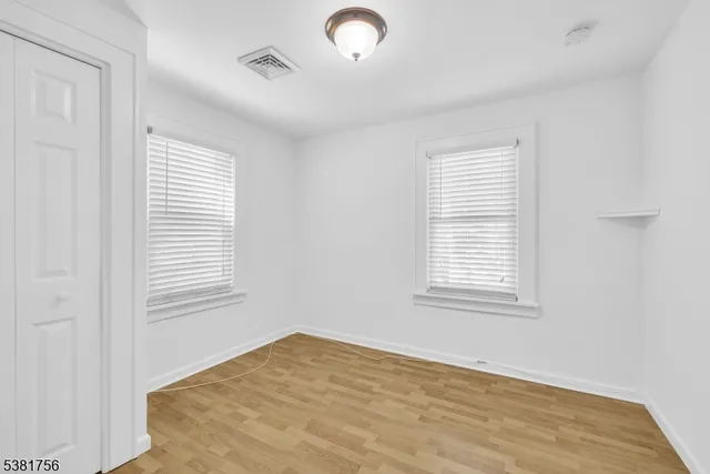 a view of a house with a yard and garage