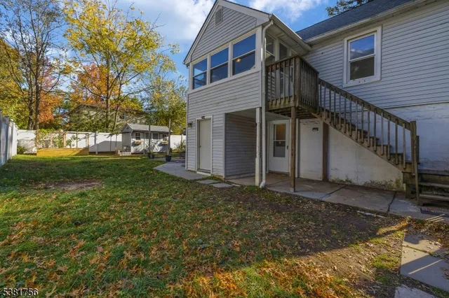 a kitchen with granite countertop cabinets and refrigerator