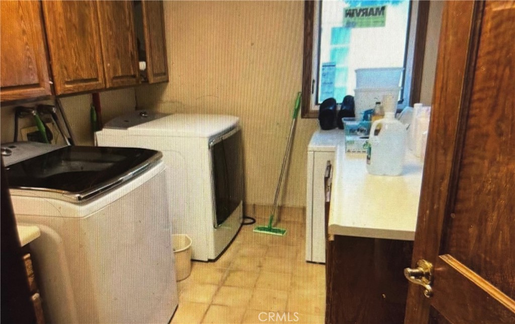 1920 Lorain Road San Marino, CA 91108 - Photo 12 of 32 a utility room with a sink washer and dryer