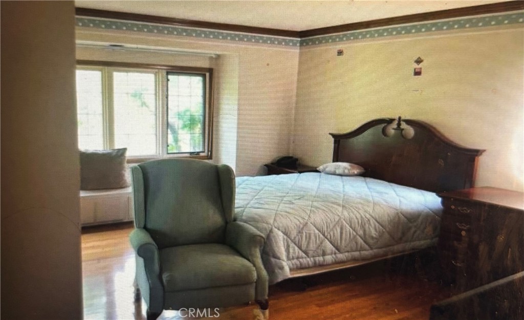 1920 Lorain Road San Marino, CA 91108 - Photo 16 of 32 a bedroom with a bed couch and a window