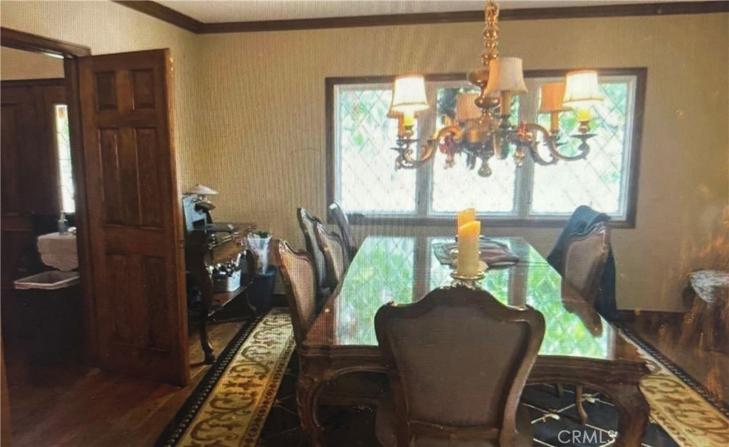 1920 Lorain Road San Marino, CA 91108 - Photo 22 of 32 a view of a dining room with furniture a rug and wooden floor