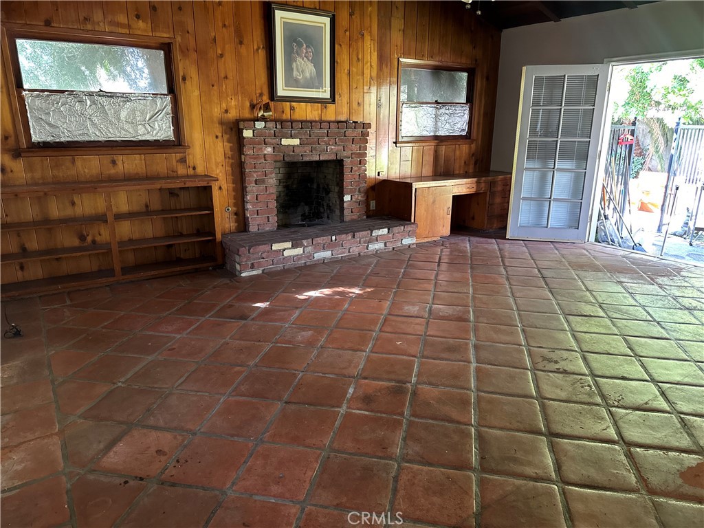 1920 Lorain Road San Marino, CA 91108 - Photo 28 of 32 a living room with furniture a flat screen tv and a fireplace