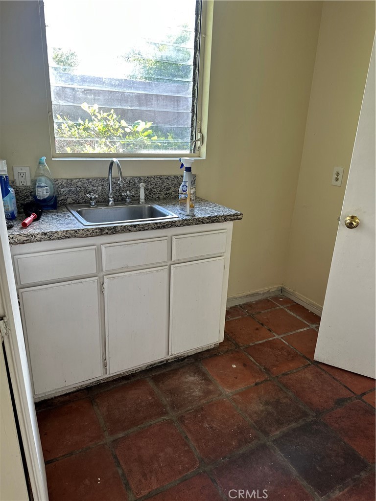 1920 Lorain Road San Marino, CA 91108 - Photo 29 of 32 a bathroom with a granite countertop sink and a window