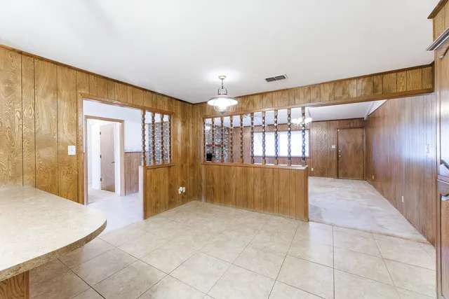 a view of a kitchen with a sink and cabinets