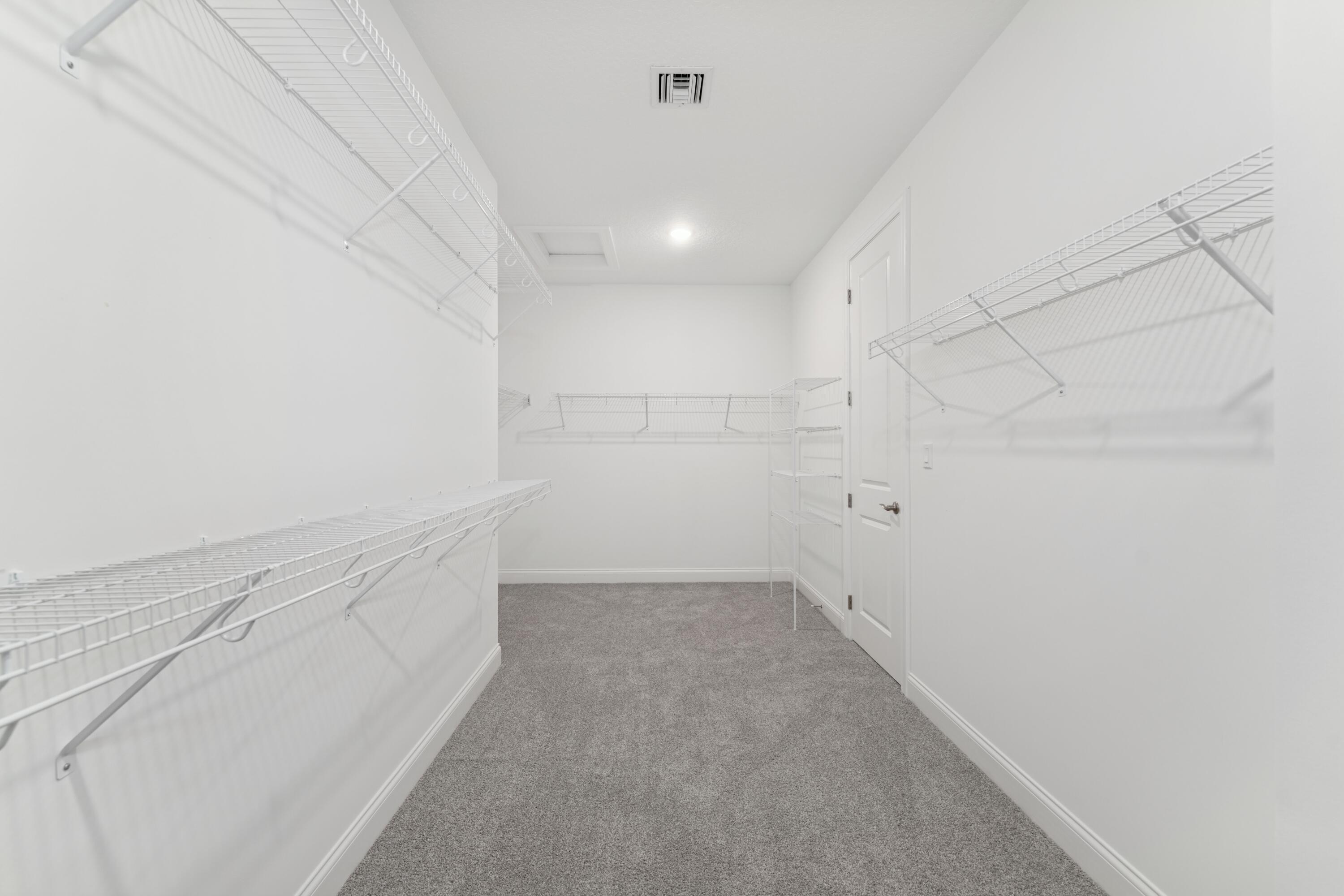 6790 Southeast Pine Drive, Unit 29 Stuart, FL 34997 - Photo 40 of 46 Primary Walk-in Closet