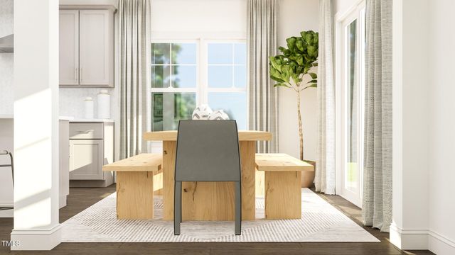 a living room with a couch and a dining table