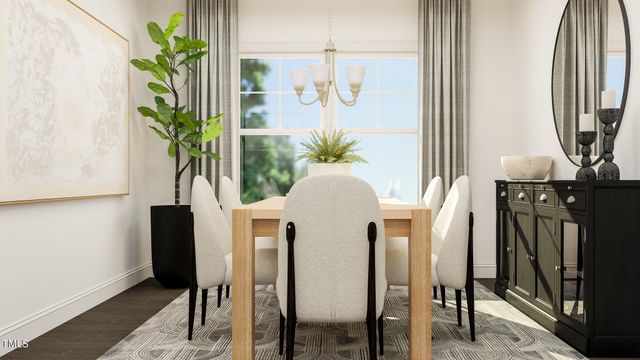 a view of a dining room with furniture and a potted plant