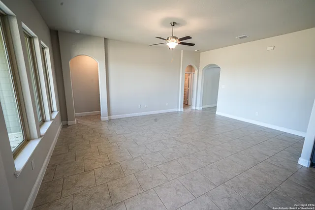 a view of an empty room with a mirror