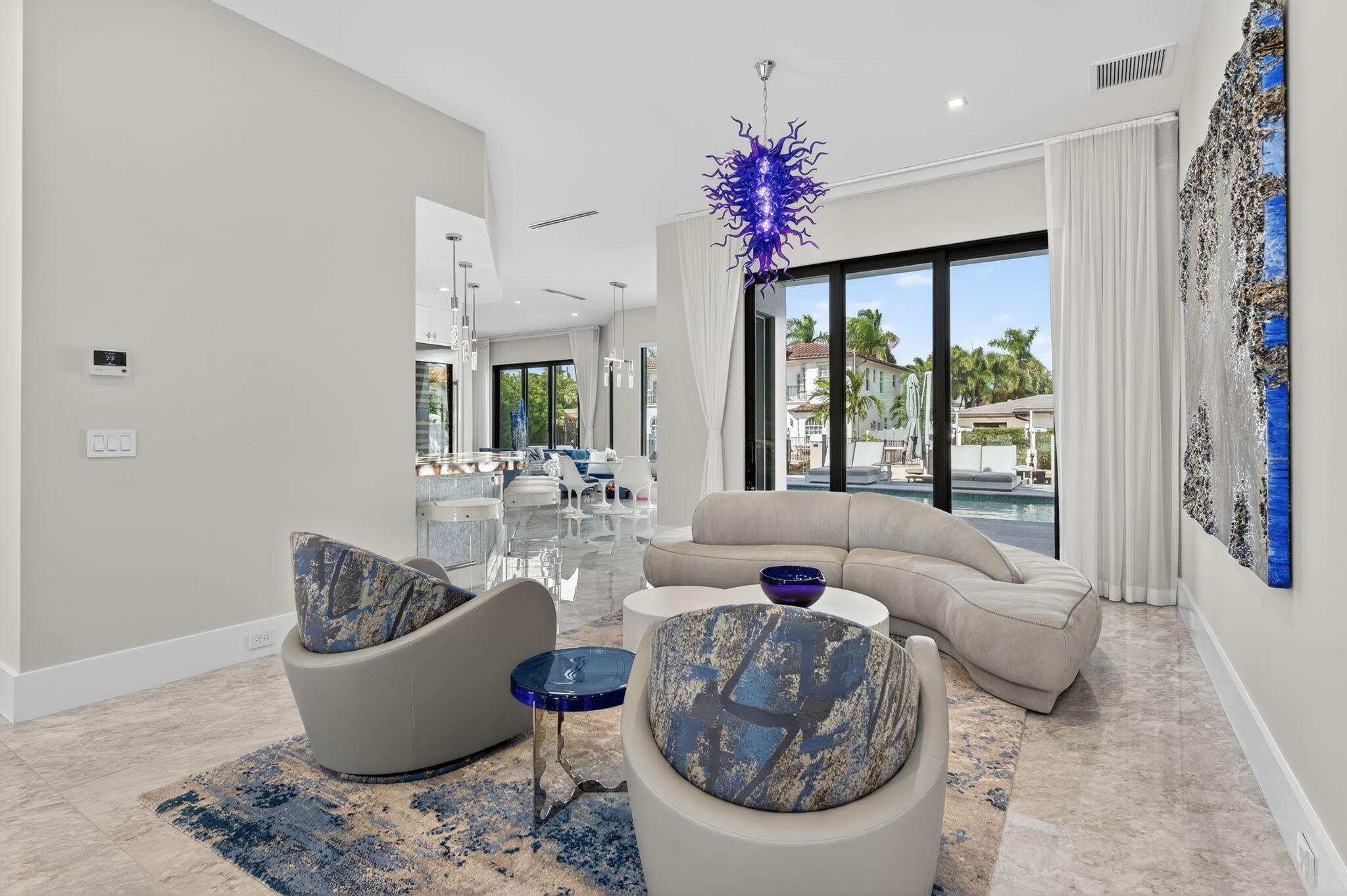 785 Northeast 70th Street Boca Raton, FL 33487 - Photo 11 of 83 a living room with furniture a large window and a chandelier