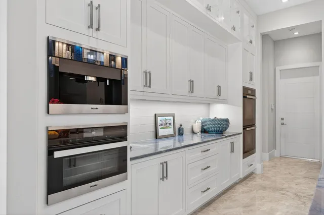 a living room with lots of furniture and a rug