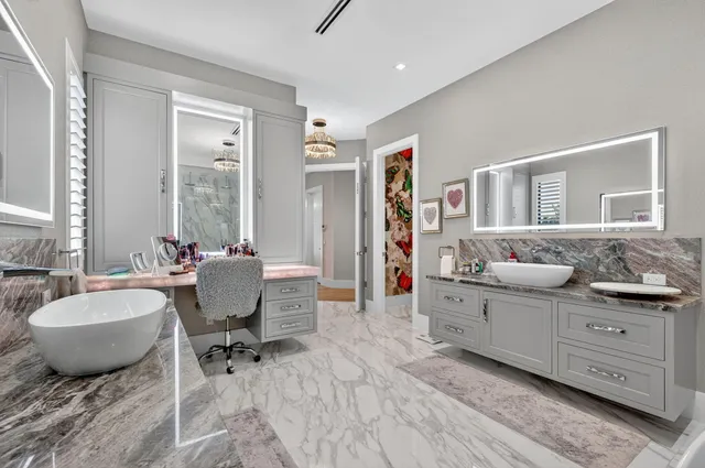 a bed room with furniture and a chandelier