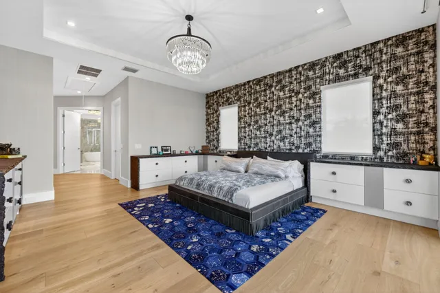 a bathroom with a double vanity sink toilet and shower