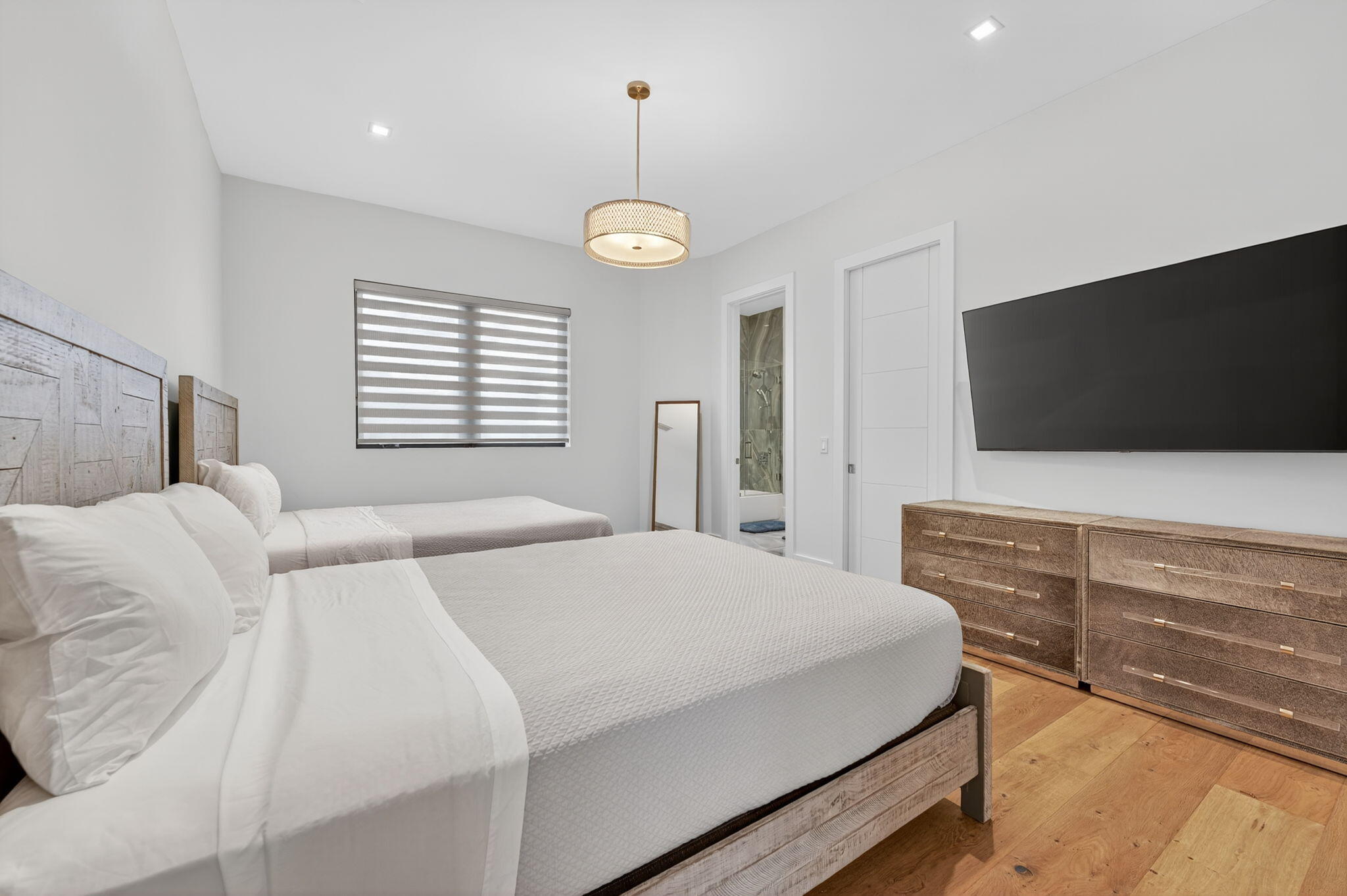 785 Northeast 70th Street Boca Raton, FL 33487 - Photo 46 of 83 a bedroom with a bed and a flat screen tv