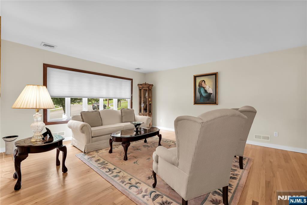 23 Ridge Court Cedar Grove, NJ 07009 - Photo 4 of 37 a living room with furniture and a table