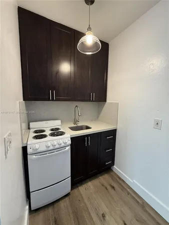 a room with a sink and a stove