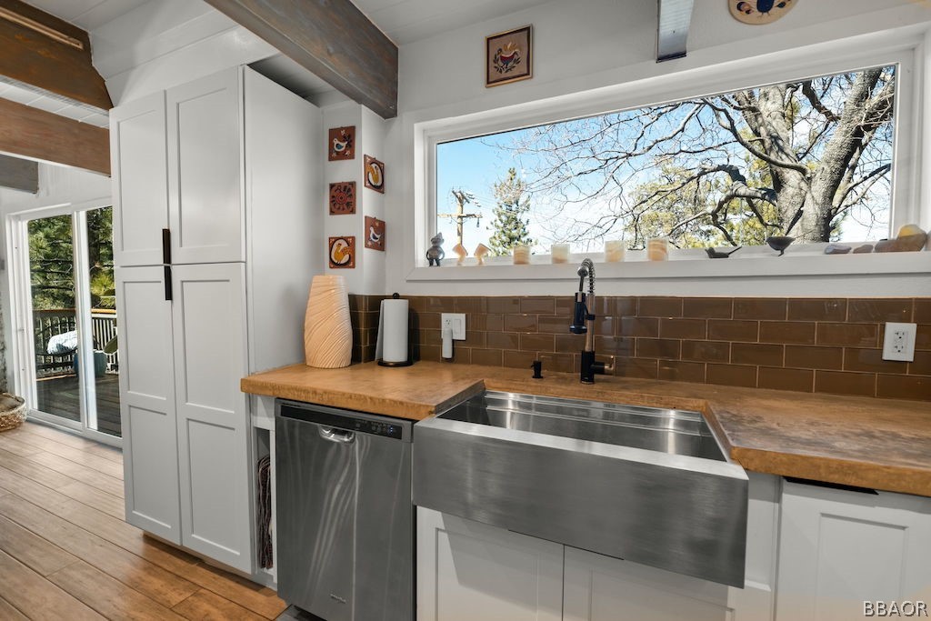 44408 Valley View Lane Sugarloaf, CA 92386 - Photo 13 of 31 a kitchen with stainless steel appliances granite countertop a sink a stove and wooden floor
