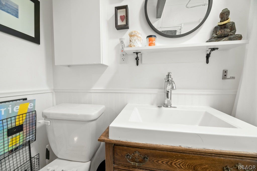 44408 Valley View Lane Sugarloaf, CA 92386 - Photo 15 of 31 a bathroom with a sink a toilet and a mirror