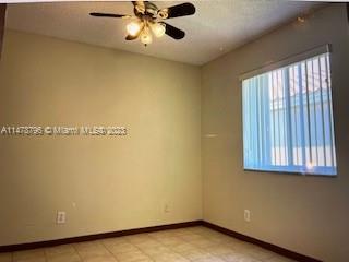 1135 Areca Way Weston, FL 33327 - Photo 17 of 45 a view of an empty room with a window