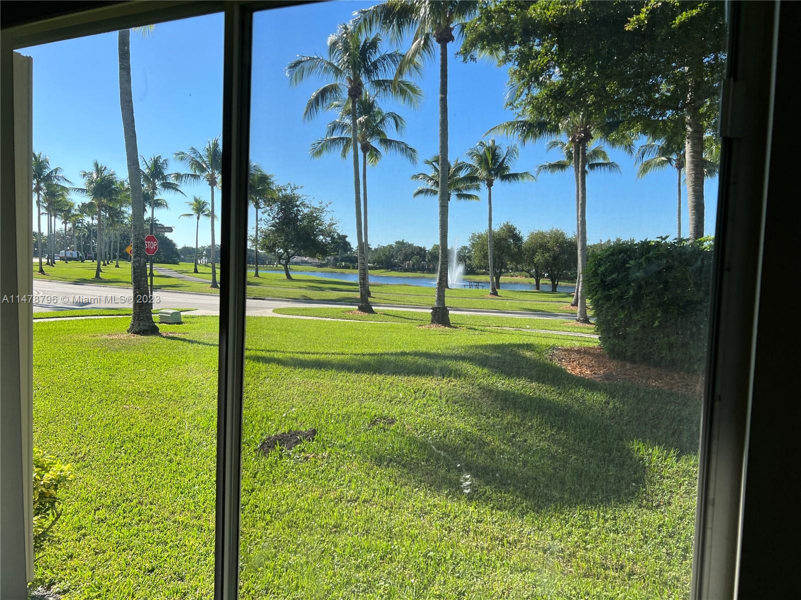1135 Areca Way Weston, FL 33327 - Photo 23 of 45 a view of a park with palm trees