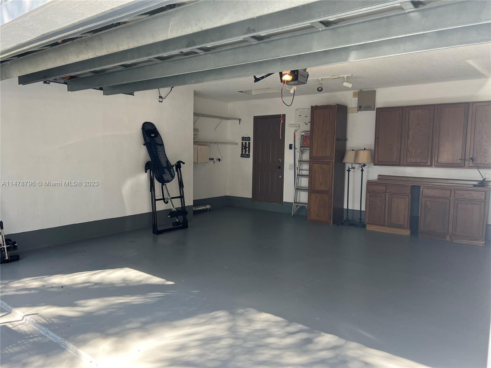 1135 Areca Way Weston, FL 33327 - Photo 25 of 45 a view of a room with gym equipment