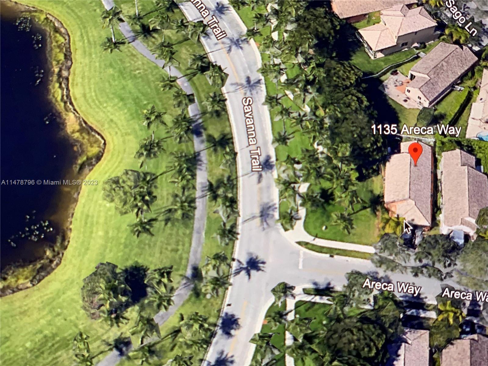 1135 Areca Way Weston, FL 33327 - Photo 29 of 45 an aerial view of a house with a yard and garden