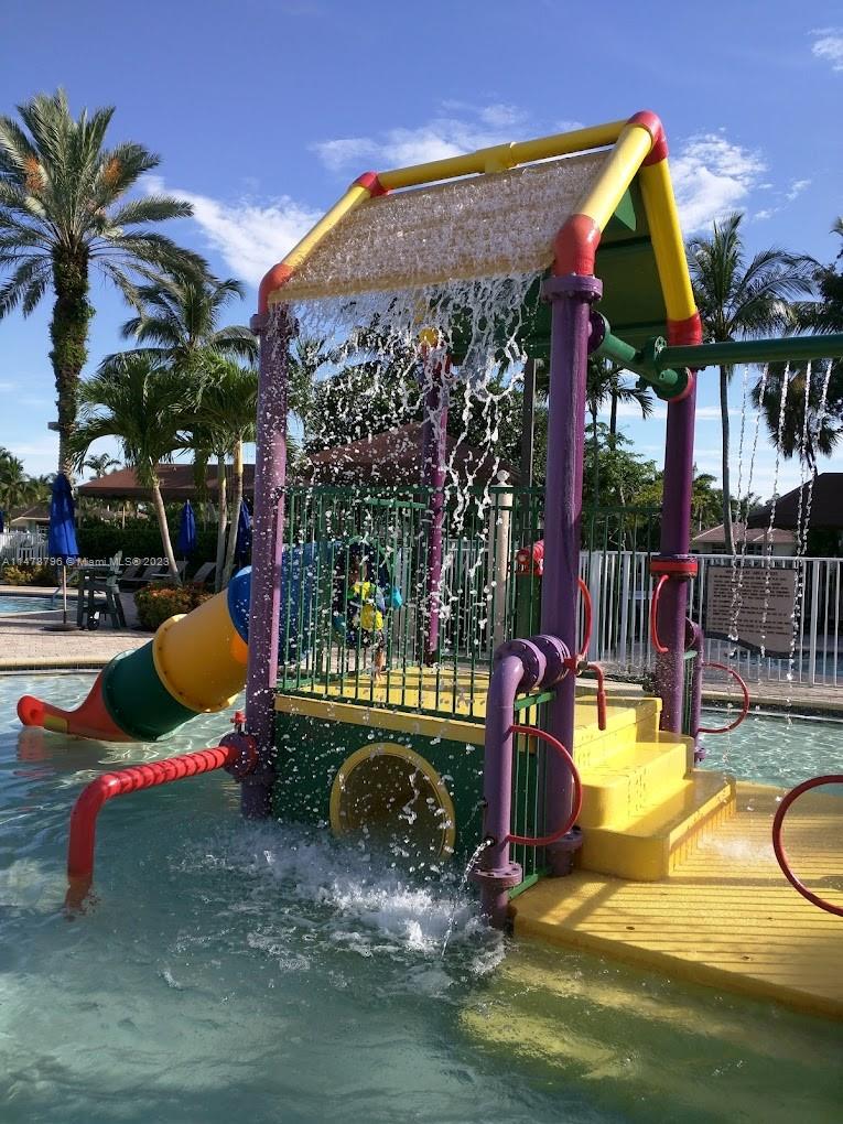 1135 Areca Way Weston, FL 33327 - Photo 35 of 45 a view of a swimming pool with a patio