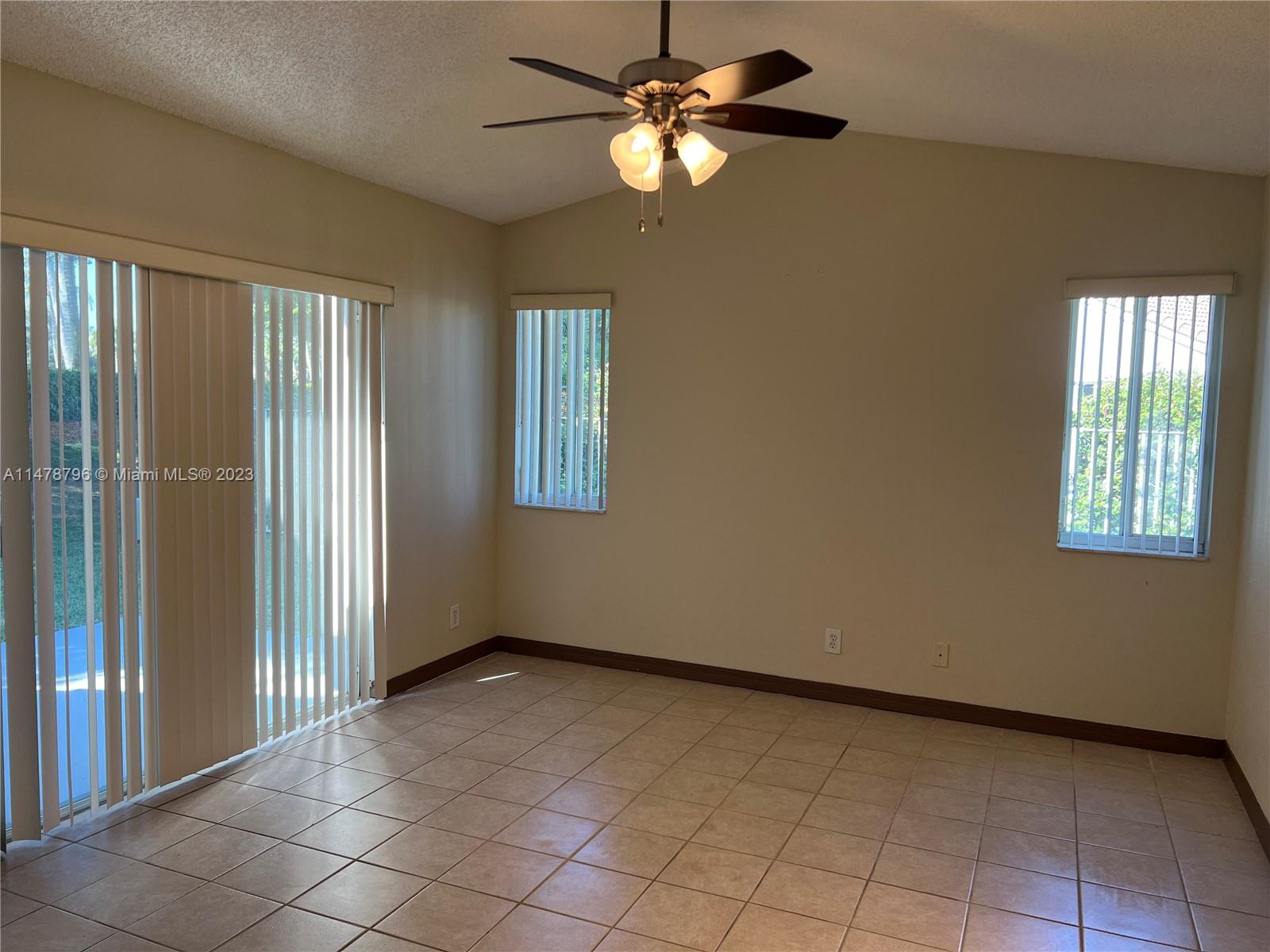 1135 Areca Way Weston, FL 33327 - Photo 4 of 45 a view of an empty room with a window