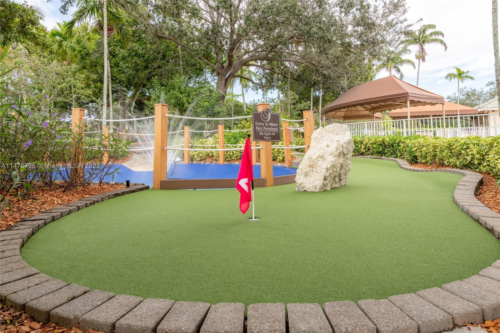 1135 Areca Way Weston, FL 33327 - Photo 44 of 45 a view of a backyard with swimming pool
