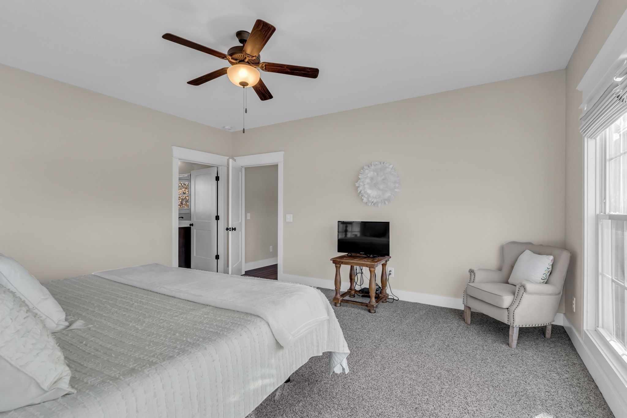 5574 Dowlen Road Cedar Hill, TN 37032 - Photo 25 of 59 a bedroom with a bed and a chair