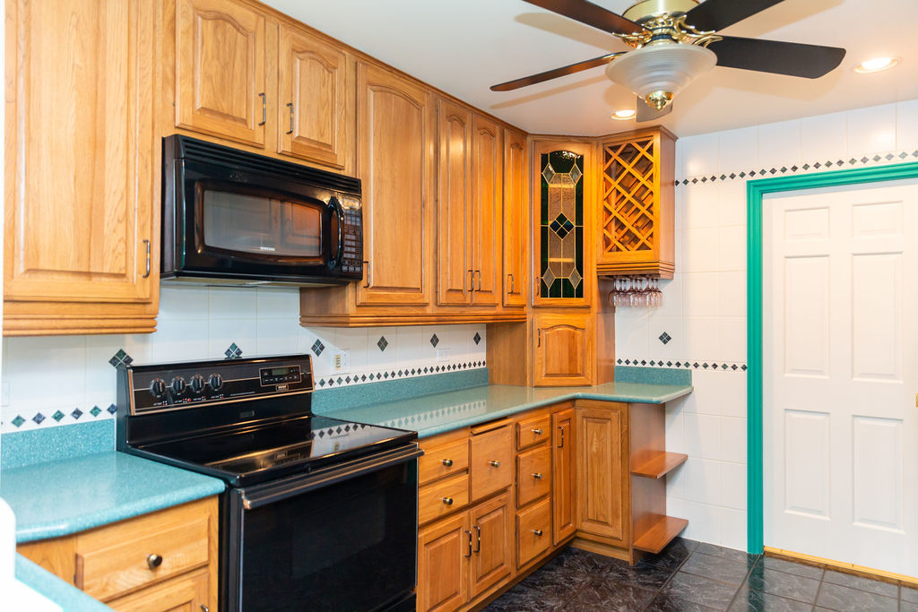 3427 Vollmer Road, Unit 209 Flossmoor, IL 60422 - Photo 13 of 45 a kitchen with stainless steel appliances granite countertop a stove a sink and a microwave