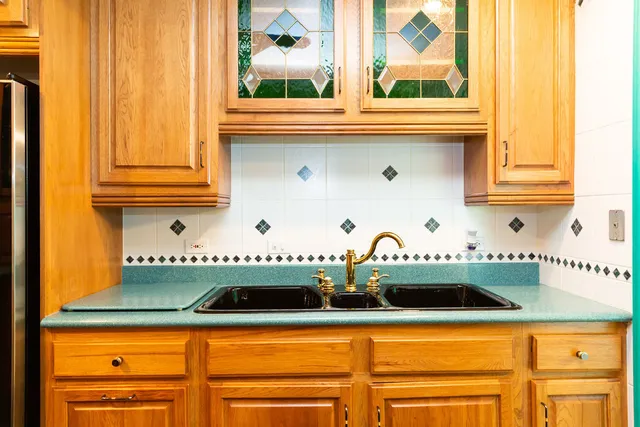 a kitchen with stainless steel appliances a stove and a microwave