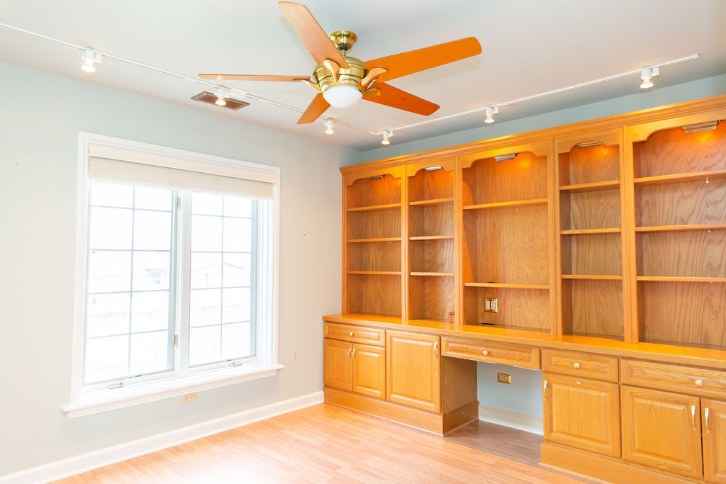 3427 Vollmer Road, Unit 209 Flossmoor, IL 60422 - Photo 33 of 45 an empty room with wooden floor and windows