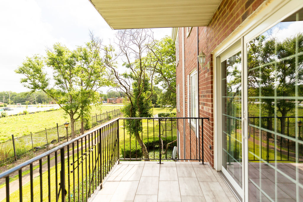3427 Vollmer Road, Unit 209 Flossmoor, IL 60422 - Photo 40 of 45 a view of balcony with floor to ceiling window and wooden fence