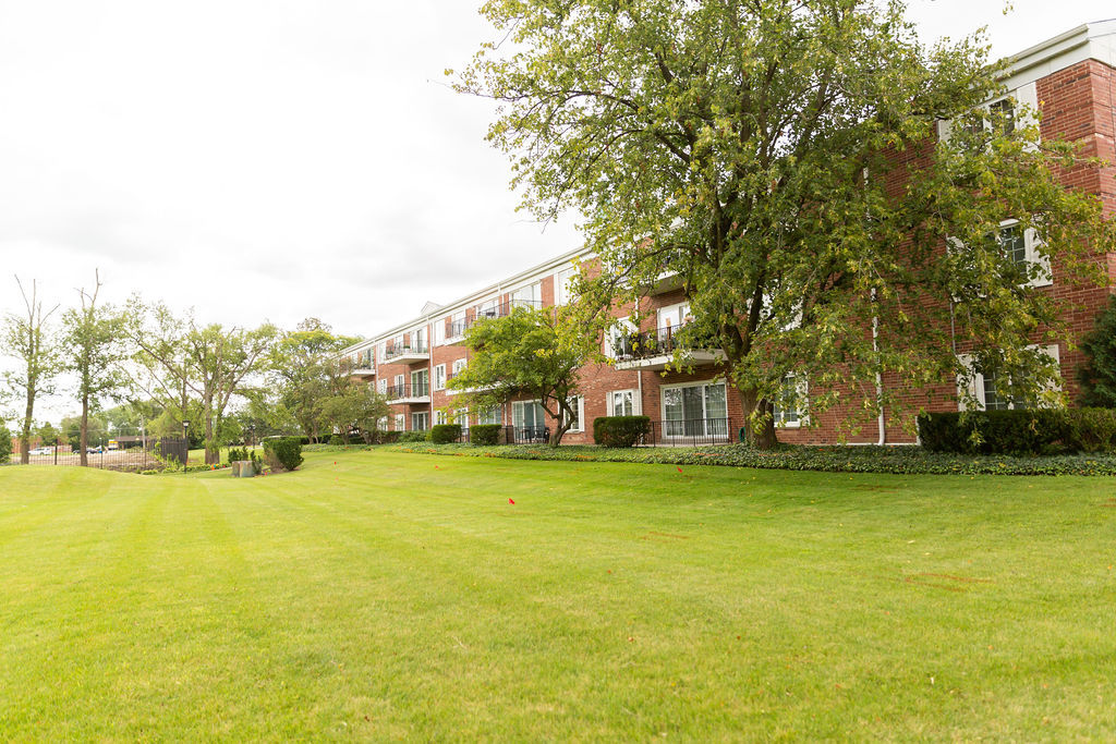 3427 Vollmer Road, Unit 209 Flossmoor, IL 60422 - Photo 43 of 45 a view of a building with trees in front of it