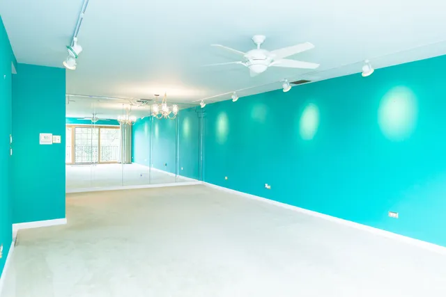 a view of a room that has a large tree