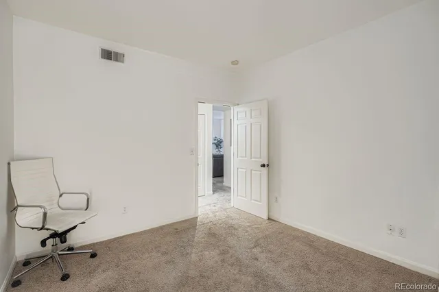 a view of a livingroom with chairs