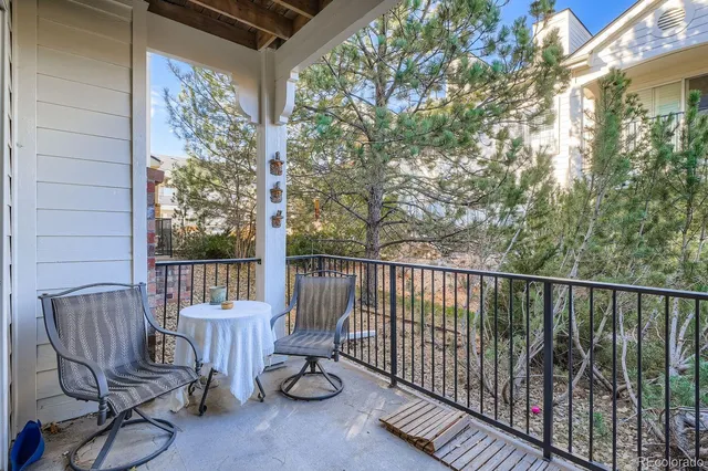 a view of a chair and table in the balcony