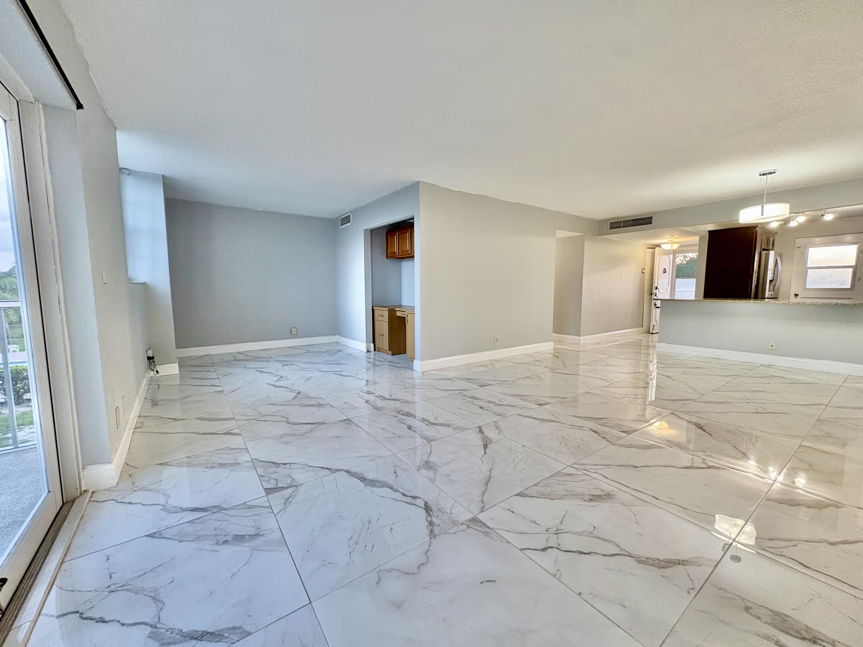 5700 Northwest 2nd Avenue, Unit 311 Boca Raton, FL 33487 - Photo 11 of 33 DEN AND LIVING ROOM