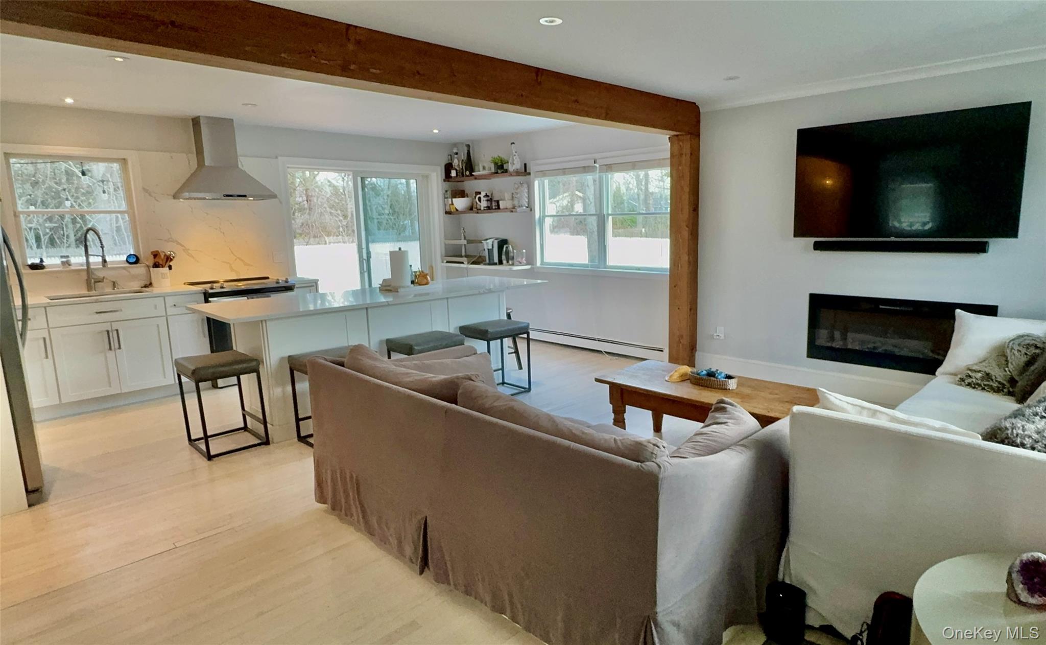 4 North Westbury Road Hampton Bays, NY 11946 - Photo 12 of 20 a living room with furniture and a flat screen tv