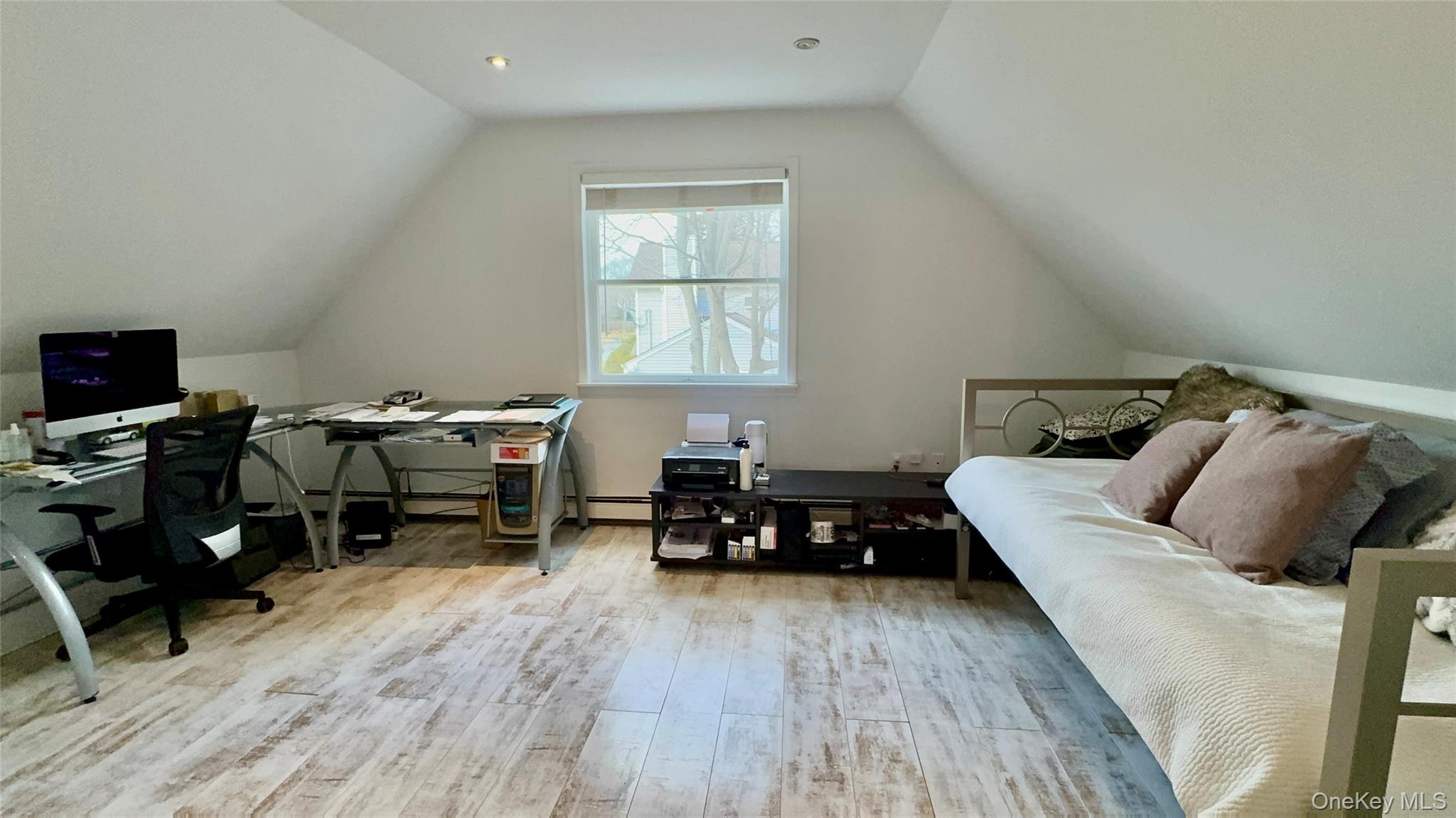 4 North Westbury Road Hampton Bays, NY 11946 - Photo 16 of 20 a bedroom with furniture and a wooden floor
