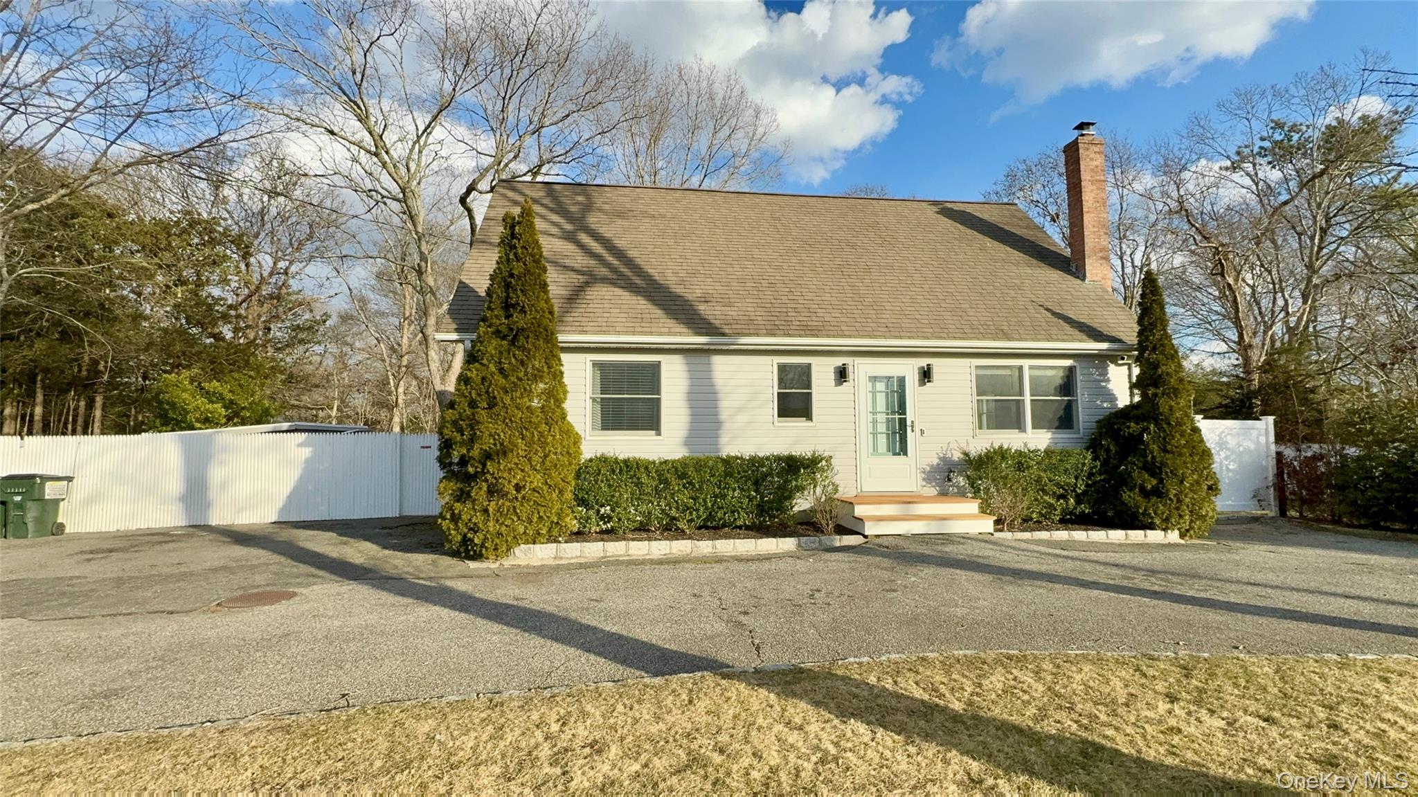 4 North Westbury Road Hampton Bays, NY 11946 - Photo 18 of 20 front view of a house with a street