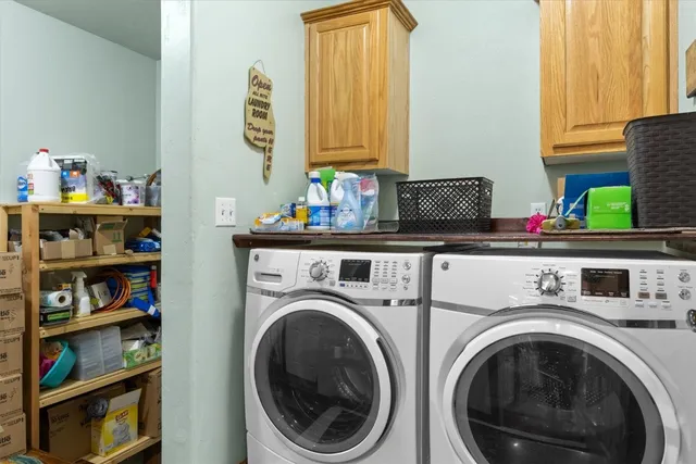 a view of kitchen and utility room with washer and dryer